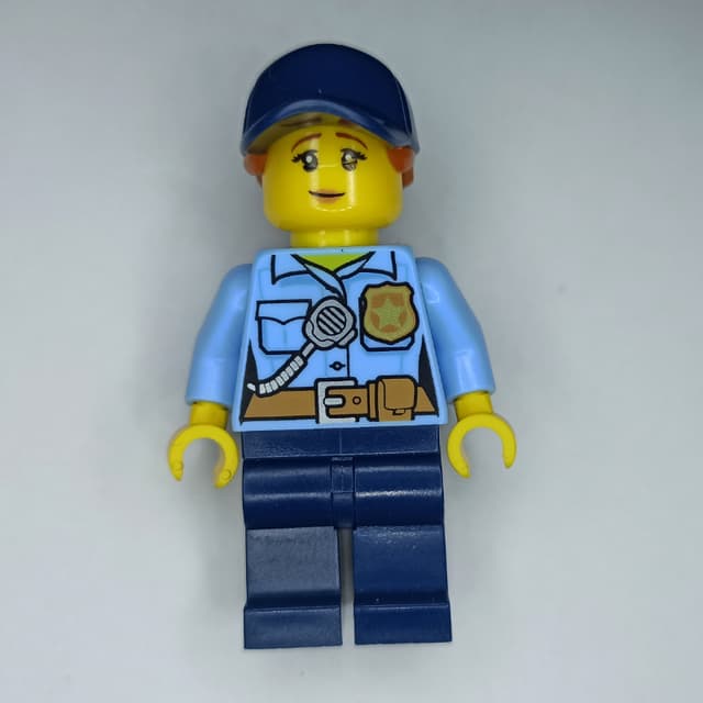 Policewoman, Bright Light Blue Shirt, Dark Blue Legs, Dark Blue Cap with Ponytail